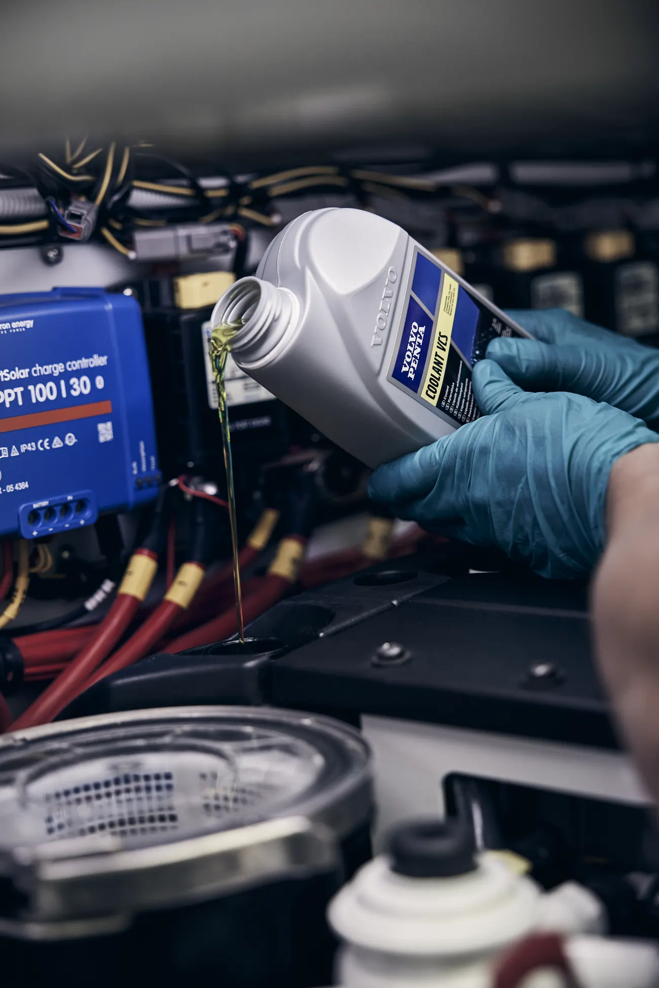 Volvo Penta coolant going into an inboard during a scheduled service